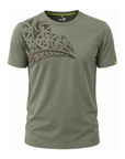 An olive green short-sleeve t-shirt with a large Polynesian tribal graphic printed on the left chest in black, gray, and red. The brand 'Wildcraft' is visible on the inner neck label.