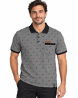 A man wearing a gray short-sleeve polo shirt with a black collar, black trim on the cuffs and pocket, and a small orange logo on the chest pocket, paired with black pants against a plain white background.