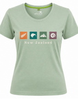 A women's short-sleeve crewneck t-shirt in sage green, featuring a 'New Zealand' graphic on the chest with four colorful icons (a fern, a kiwi, mountains, and a spiral) and the 'wild river' brand logo printed inside the collar.