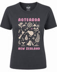 A dark charcoal gray short-sleeve t-shirt with a graphic print on the front. The print features the words 'AOTEOROA' and 'NEW ZEALAND' in pink, framing a central cream-colored illustration of New Zealand wildlife, flora, and scenery.