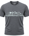 A dark heather gray short-sleeve t-shirt with a white line art graphic of a mountain range and pine forest across the chest, featuring the 'Wild Knout' brand logo printed inside the collar.