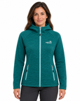A woman wearing a teal heathered full-zip hooded jacket with zippered hand pockets, shown against a plain white background.