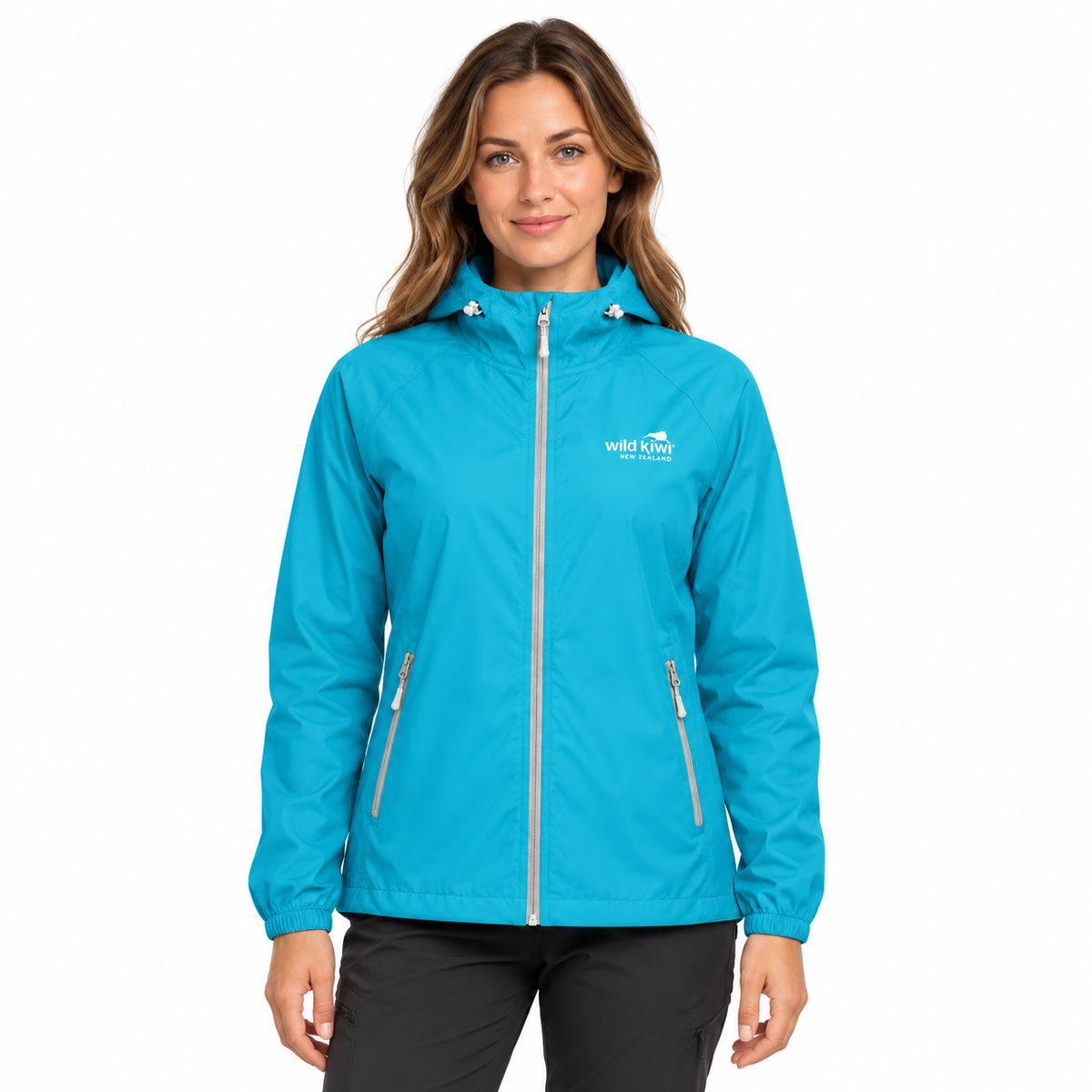 A woman wearing a bright turquoise blue hooded jacket with a full front zipper, zippered hand pockets, and a white 'Wild Apple' logo on the left chest, photographed against a plain white background.