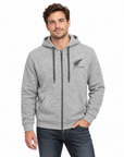 A man wearing a heather gray full-zip hoodie with a black fern logo and 'Wanganui' text on the left chest, paired with dark blue jeans, against a plain white background.