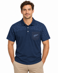 A man wearing a navy blue short-sleeve polo shirt with a subtle paisley pattern on the shoulders and a chest pocket featuring a silver fern logo and 'WELLINGTON' text, paired with khaki pants, against a plain white background.
