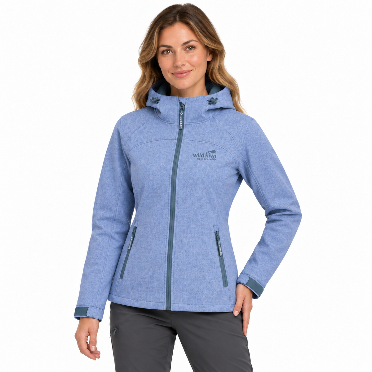 A woman modelling a heathered light blue hooded jacket with a full front zipper, zippered hand pockets, and a visible West Elm logo on the left chest, against a plain white background.
