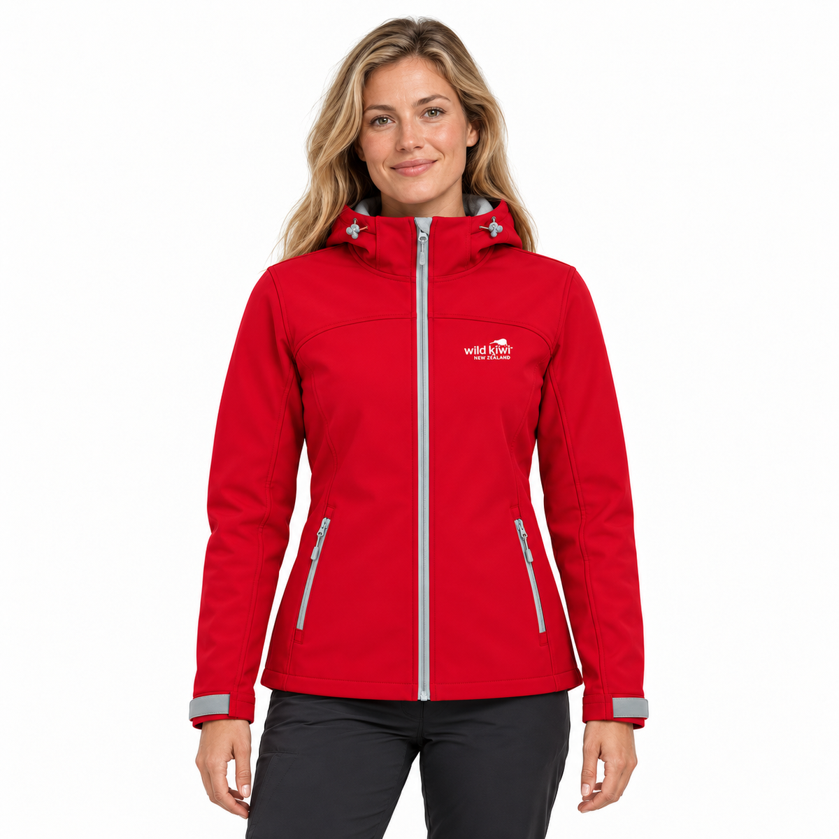 A woman wearing a bright red hooded jacket with a silver zipper and a white 'Wild Apple Tree Club' logo on the left chest, paired with black pants, against a plain white background.