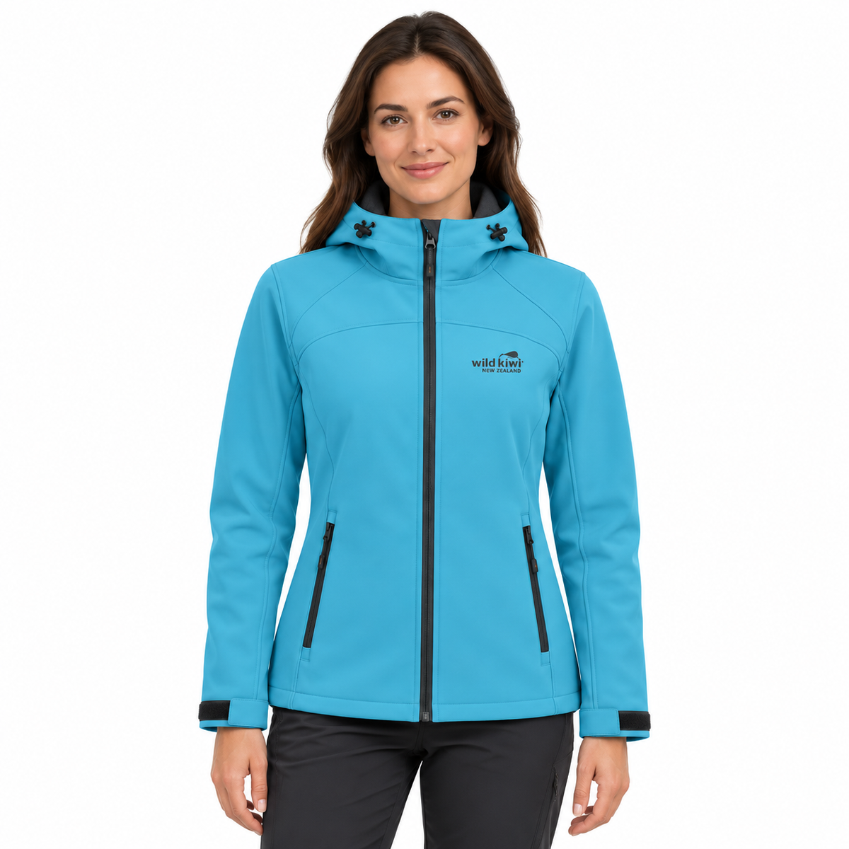 A woman wearing a bright turquoise blue hooded softshell jacket with black zipper details and a visible Wild River Designs logo on the left chest, photographed against a plain white background.