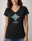 Women wearing a black V-neck t-shirt with a Maori design and New Zealand and Aotearoa text a plain background