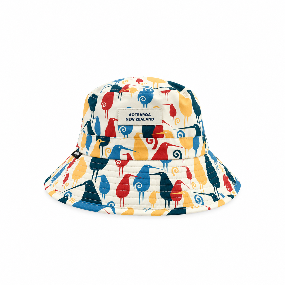 A bucket hat featuring a colourful, stylised bird pattern on a cream background, with a white label reading 'AOTEAROA NEW ZEALAND' on the front.