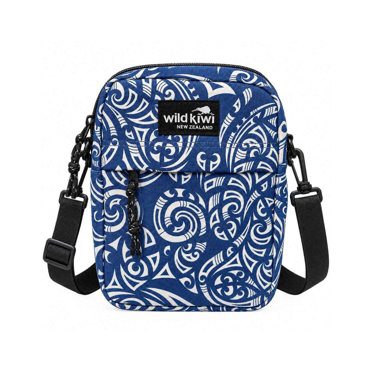 A blue and white patterned crossbody bag with a black Wild Kiwi brand patch on the front, black straps, and a clean white background.