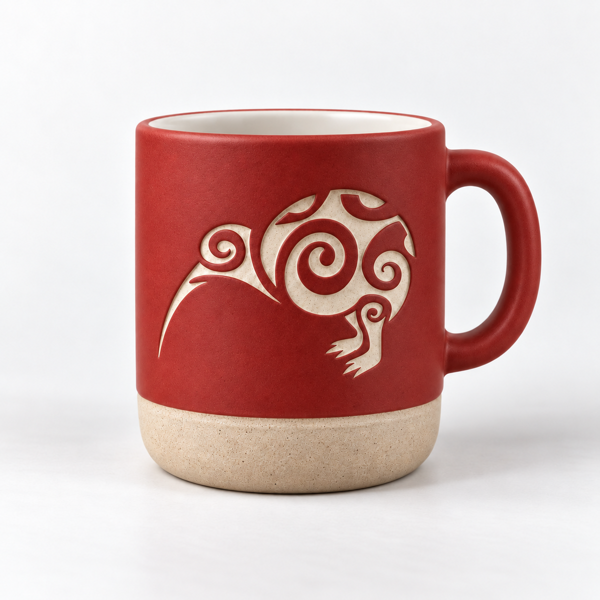 A ceramic mug with a deep red upper body, a beige footed base, and a white stylised bird graphic on the front, shown against a plain white background.