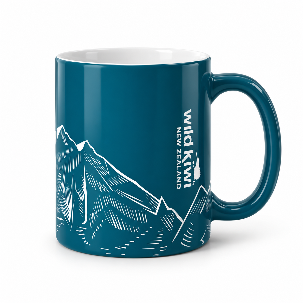 A dark teal ceramic mug featuring a white line art illustration of mountain peaks and the vertical text 'Wild Kiwi New Zealand' on the side, shown against a plain white background.