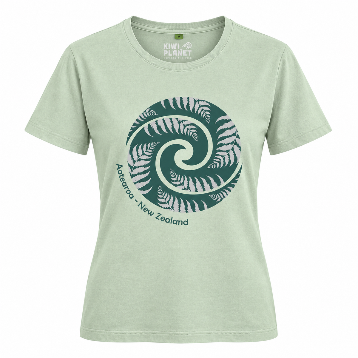 A light sage green short-sleeve t-shirt with a large dark green and white fern spiral graphic on the front, featuring the text 'Aoraea - New Zealand' and a 'KIWI PLANET' brand label inside the collar.