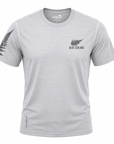 A light gray heather crewneck t-shirt featuring a black New Zealand fern and 'NEW ZEALAND' text on the left chest, with a black fern graphic on the right sleeve and 'ACTIVE FIT' text near the bottom hem.
