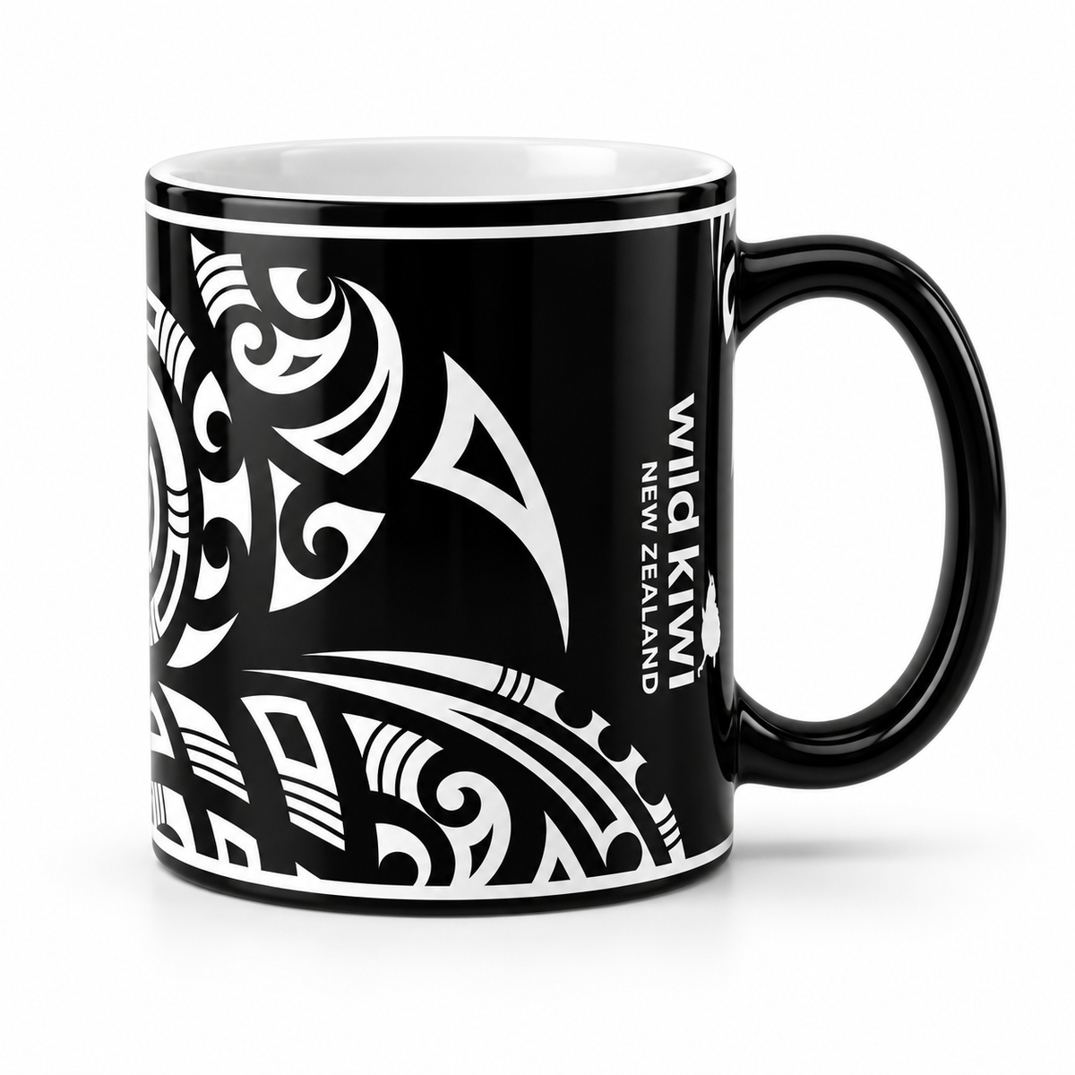 A black ceramic mug featuring a white Polynesian tribal design and the text 'WILD KIWI NEW ZEALAND' printed on the side, set against a plain white background.